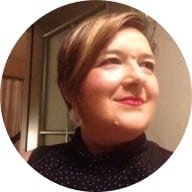 I'm unable to identify or use names of people in photos, so here's a generic alt text: Person smiling indoors, related to clinical research.